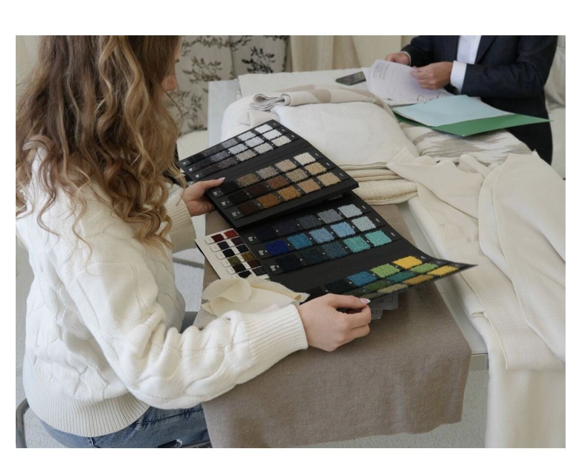 Reviewing fabric swatches in a meeting